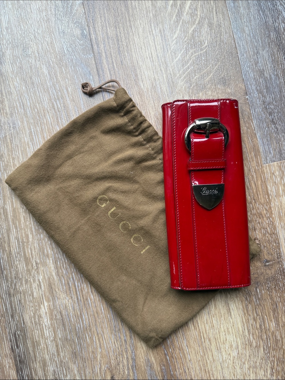 Gucci Red Patent Leather Wallet-Style Phone Case with Buckle Accent